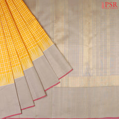 Amber Yellow Kanchipuram Silk Saree with small checkered weave, Taupe Grey zari chit pallu, temple border, and a matching plain Taupe Grey blouse