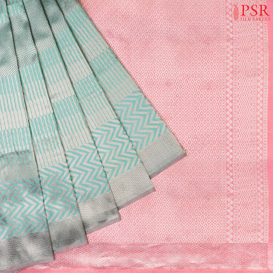 PSR Silk Sarees presents an elegant Aqua Pearl&nbsp;Banaras Silk Saree, a masterpiece of heritage and craftsmanship.