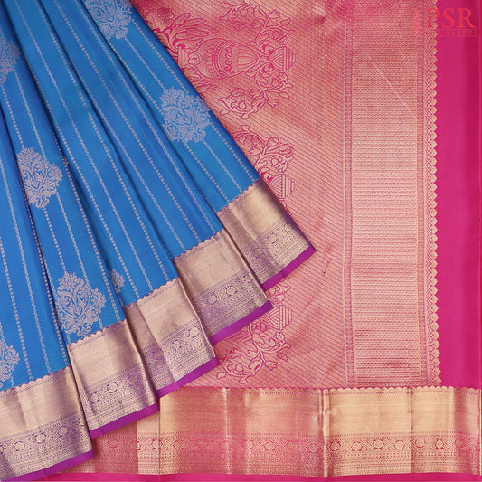 PSR Silks presents a Azure Blue Fancy Kanchipuram Silk Saree, elegantly paired with a striking Magenta Pink combination. A timeless blend of tradition and grace!