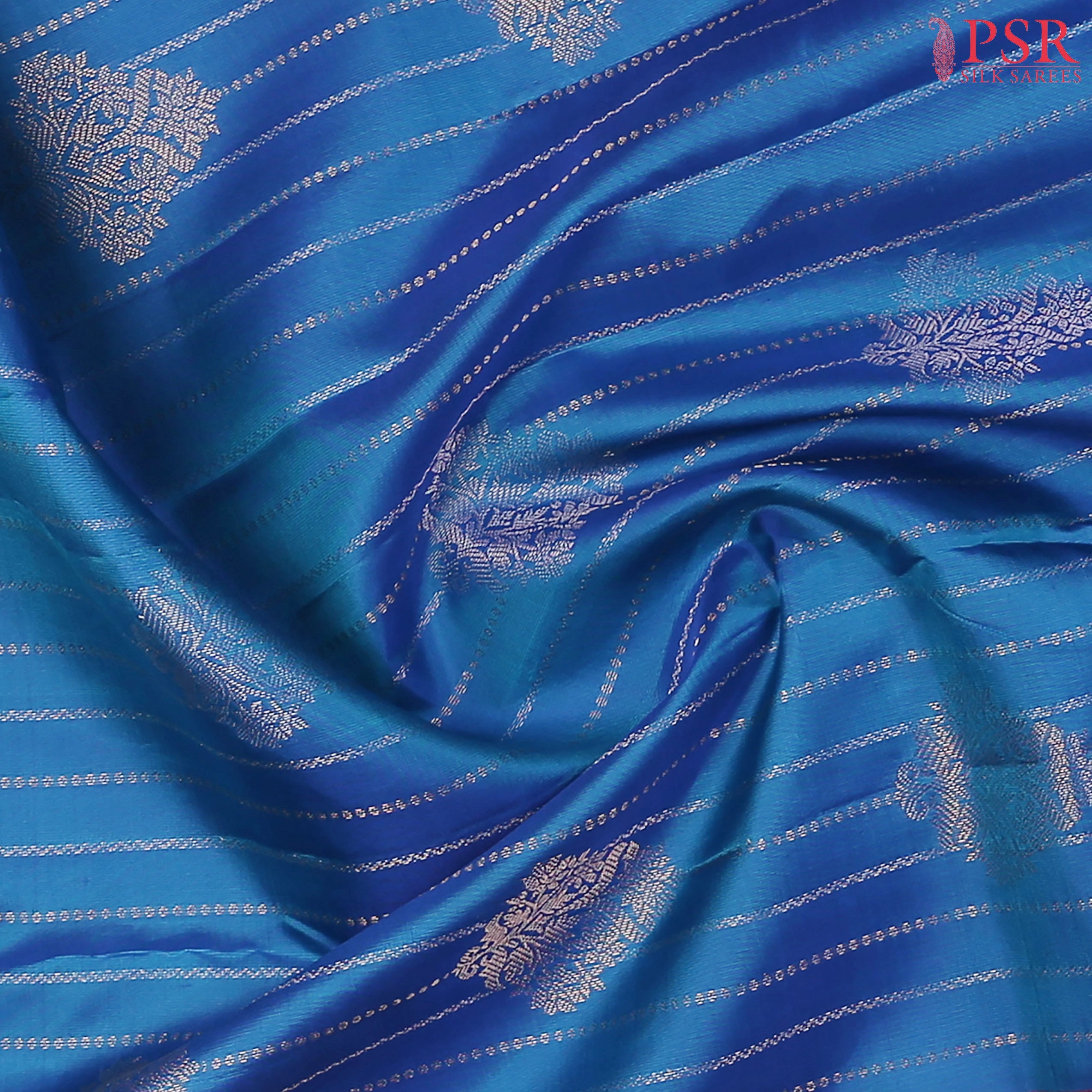 PSR Silks presents a Azure Blue Fancy Kanchipuram Silk Saree, elegantly paired with a striking Magenta Pink combination. A timeless blend of tradition and grace!