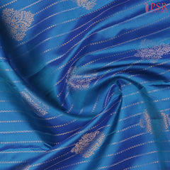 PSR Silks presents a Azure Blue Fancy Kanchipuram Silk Saree, elegantly paired with a striking Magenta Pink combination. A timeless blend of tradition and grace!