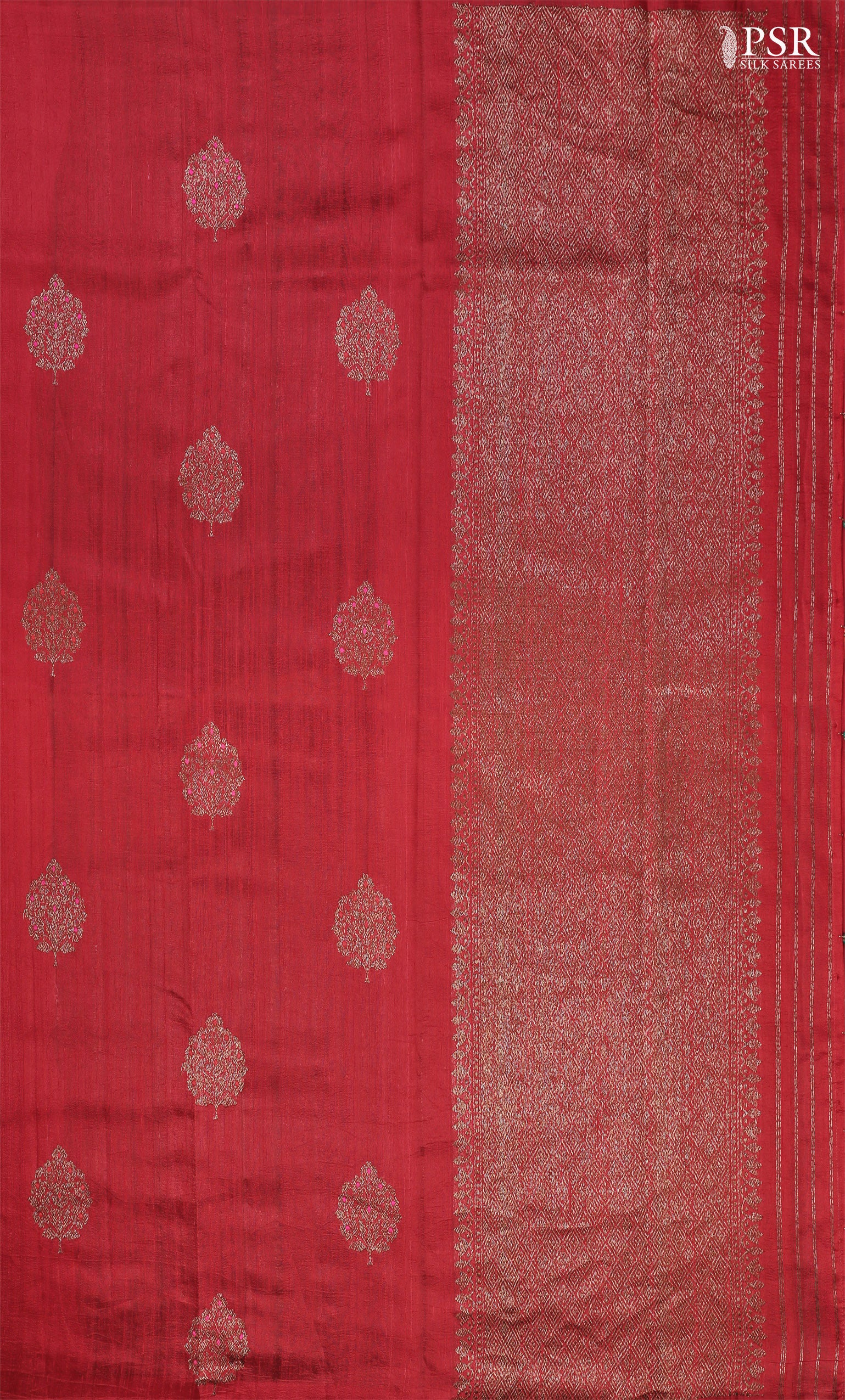 PSR Silks proudly presents a regal&nbsp;Red Banaras Jute Silk Saree, paired with a rich Dark Green combination.