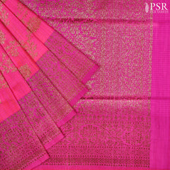 PSR Silks presents a stunning Barbie Pink Banarasi Silk Saree, beautifully contrasted with rich Magenta Pink accents.