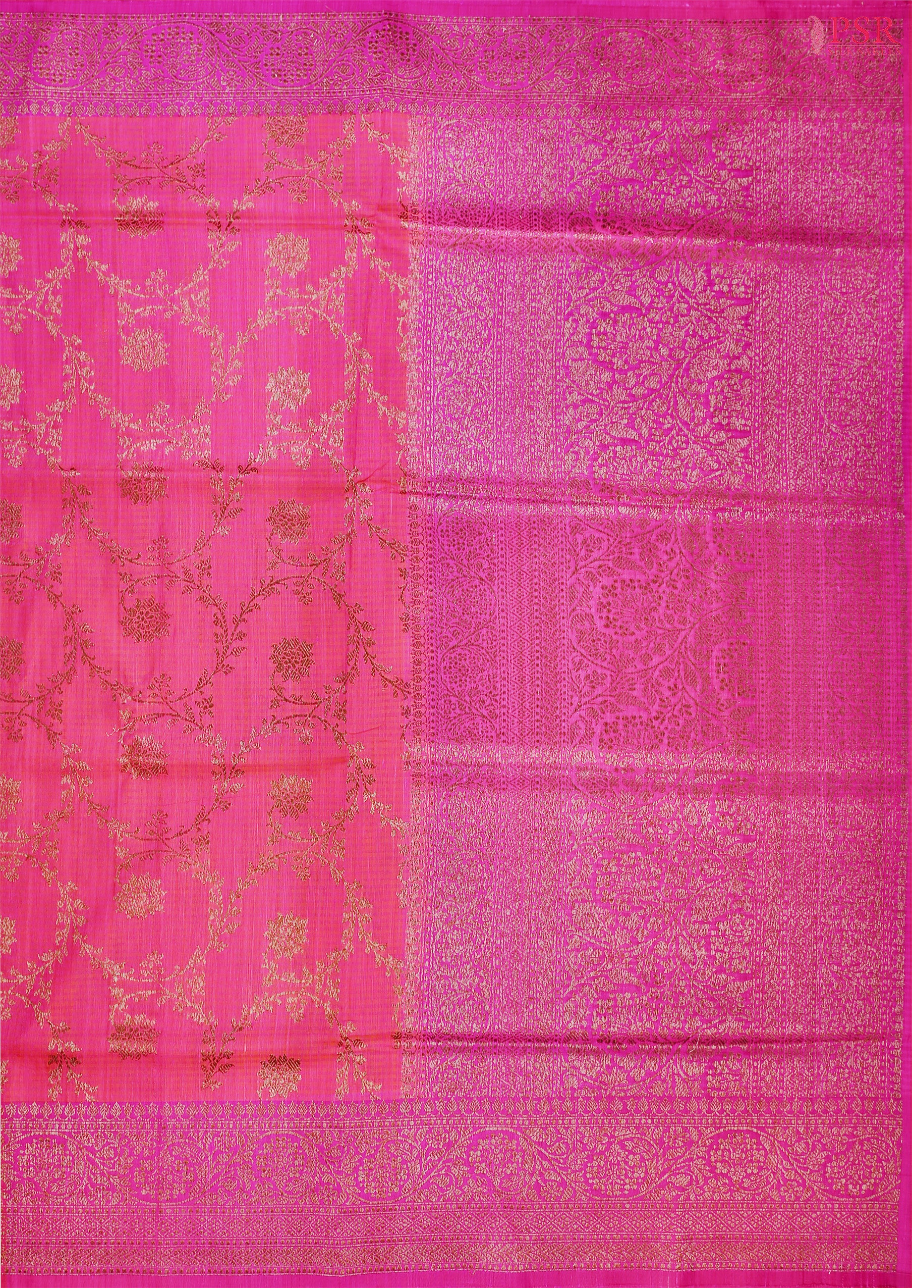 PSR Silks presents a stunning Barbie Pink Banarasi Silk Saree, beautifully contrasted with rich Magenta Pink accents.