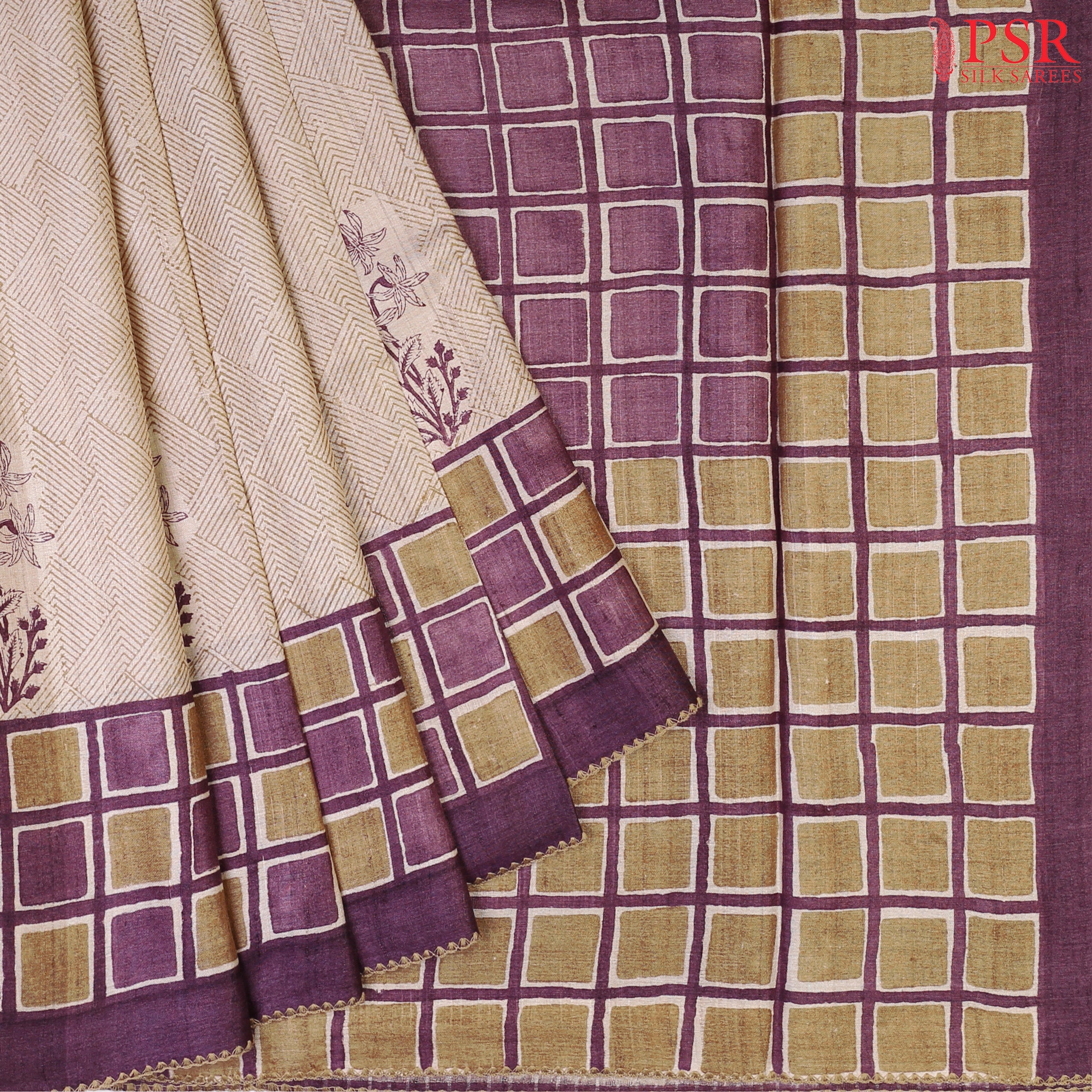 Beige Kadhi Tussar Silk Saree featuring purple floral prints, Olive Grove tessellation designs, and a checkered pallu with a Purple tissue-striped blouse.