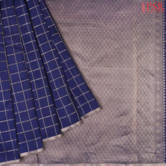 PSR Silks presents a Berry Blue Fancy Kanchipuram Silk Saree, elegantly paired with a zari checkered pattern. A timeless blend of tradition and grace!