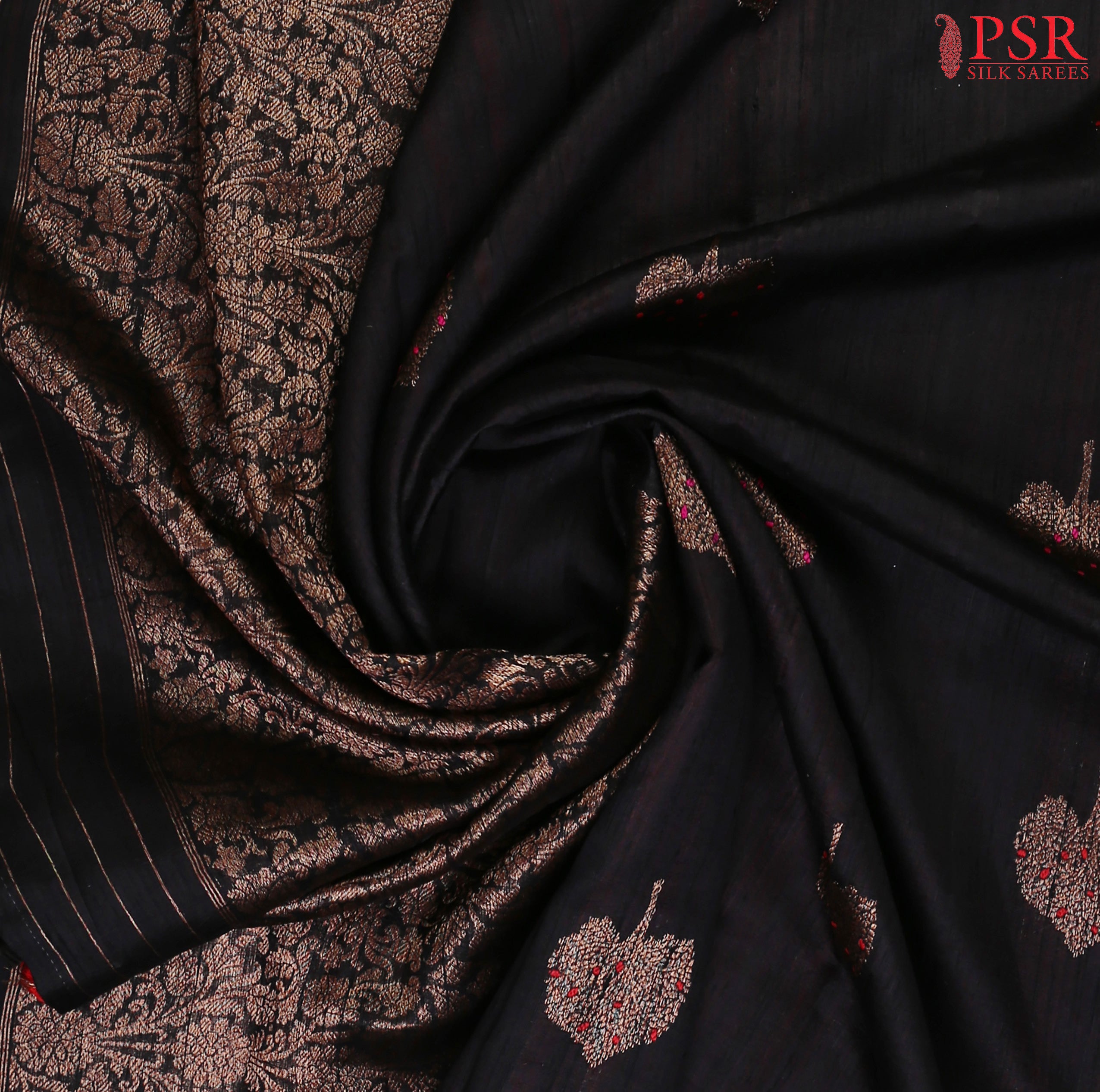 PSR Silks proudly presents a regal Black&nbsp;Banaras Jute Silk Saree, paired with a rich Red combination. 