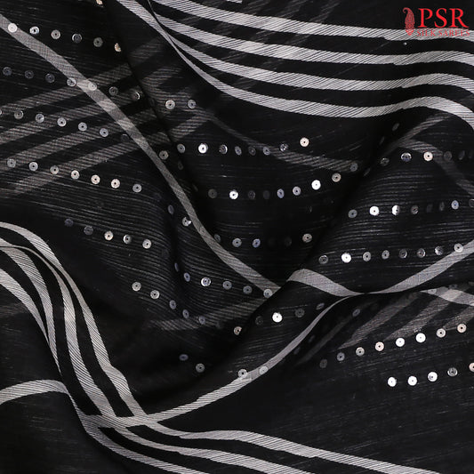 Black Kadhi Tussar Silk Saree with white designer print and subtle sequin embellishments, paired with a plain pallu and blouse for a refined look.