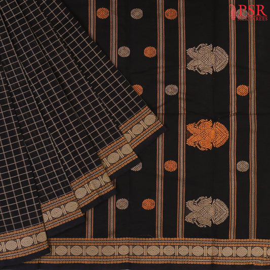 PSR Silks presents a traditional handloom Kalakshetra Kovai Cotton saree in a captivating Black & beautifully weaved with beige & orange thread work.