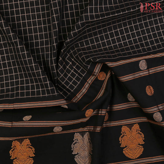 PSR Silks presents a traditional handloom Kalakshetra Kovai Cotton saree in a captivating Black & beautifully weaved with beige & orange thread work.