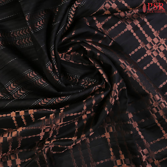 Indulge in timeless elegance with our Black&nbsp;Soft Silk Saree, crafted to perfection with&nbsp;impressive copper zari jacquard stripes patterm.