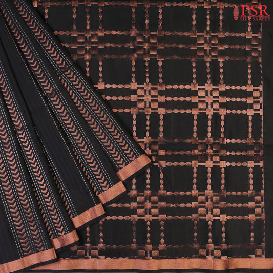 Indulge in timeless elegance with our Black&nbsp;Soft Silk Saree, crafted to perfection with&nbsp;impressive copper zari jacquard stripes patterm.