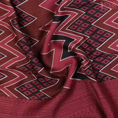 Brown Kadhi Tussar Silk Saree with Black & Cerise Maroon hues, featuring a tri-colored chevron pattern, zari-striped pallu, and a matching printed blouse.