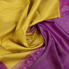 Wrap yourself in the radiance of tradition with our Burberry Yellow Soft Silk Saree, beautifully contrasted with a Vivid Violet hue. 