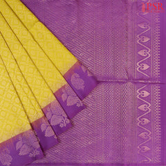 Wrap yourself in the radiance of tradition with our Burberry Yellow Soft Silk Saree, beautifully contrasted with a Vivid Violet hue. 