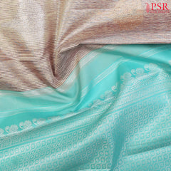 Budding Peach Kanchipuram Silk Saree from "Shrestha Kanjivaram" with Saaral Tissue Weaves, Floral Zari Motifs, One-Sided Zari Jacquard Border & Turquoise Pallu – PSR Silks