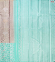 Budding Peach Kanchipuram Silk Saree from "Shrestha Kanjivaram" with Saaral Tissue Weaves, Floral Zari Motifs, One-Sided Zari Jacquard Border & Turquoise Pallu – PSR Silks