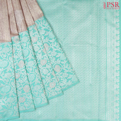 Budding Peach Kanchipuram Silk Saree from "Shrestha Kanjivaram" with Saaral Tissue Weaves, Floral Zari Motifs, One-Sided Zari Jacquard Border & Turquoise Pallu – PSR Silks