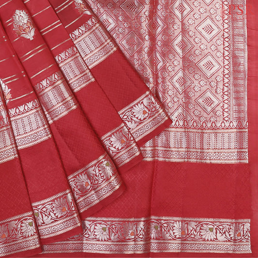 Drape yourself in the opulence of our Carmine Red Chiniya Silk Saree, beautifully paired with a Dark Green contrast.