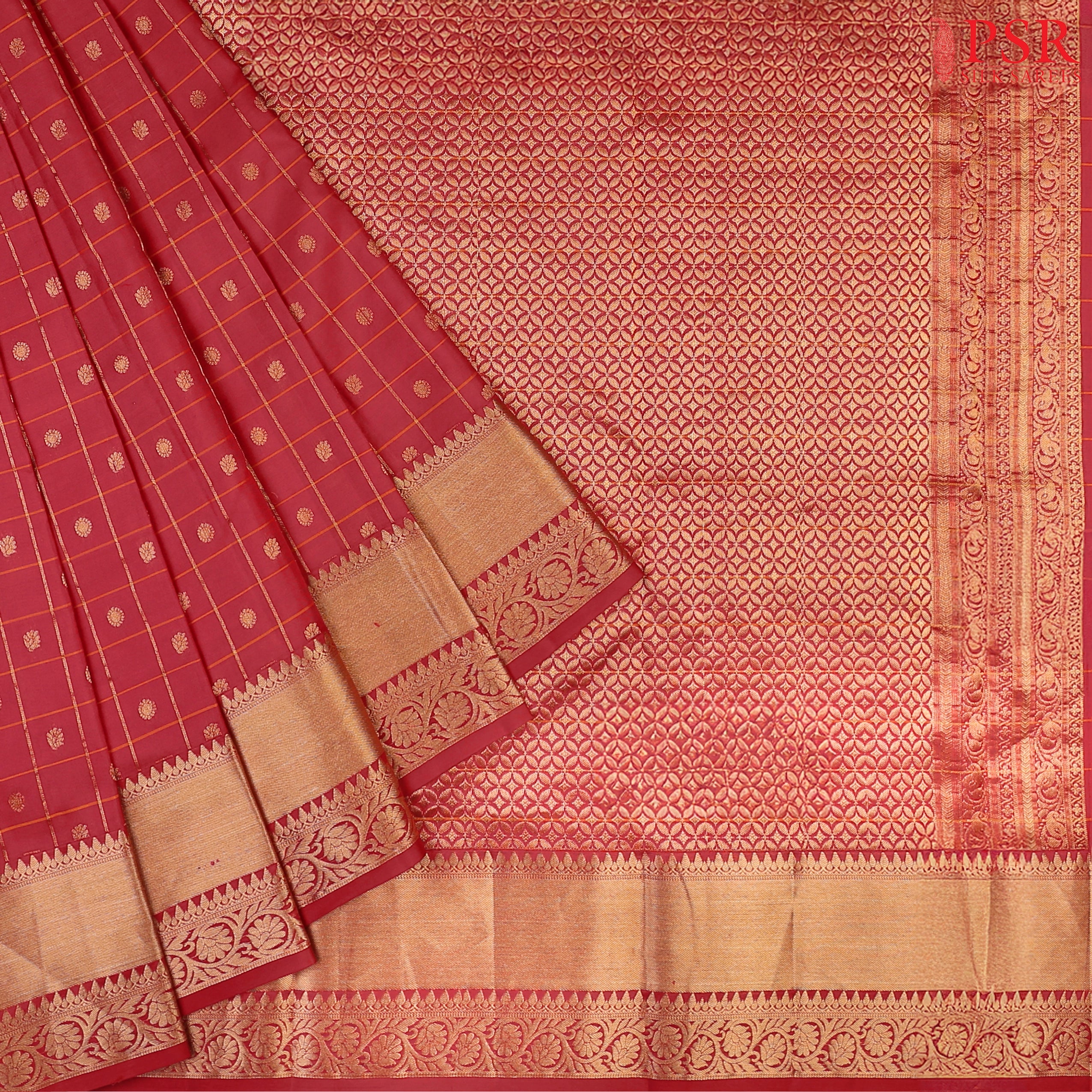 PSR Silks presents a Carmine Red Fancy Kanchipuram Silk Saree, elegantly paired with a zari checks pattern. A timeless blend of tradition and grace