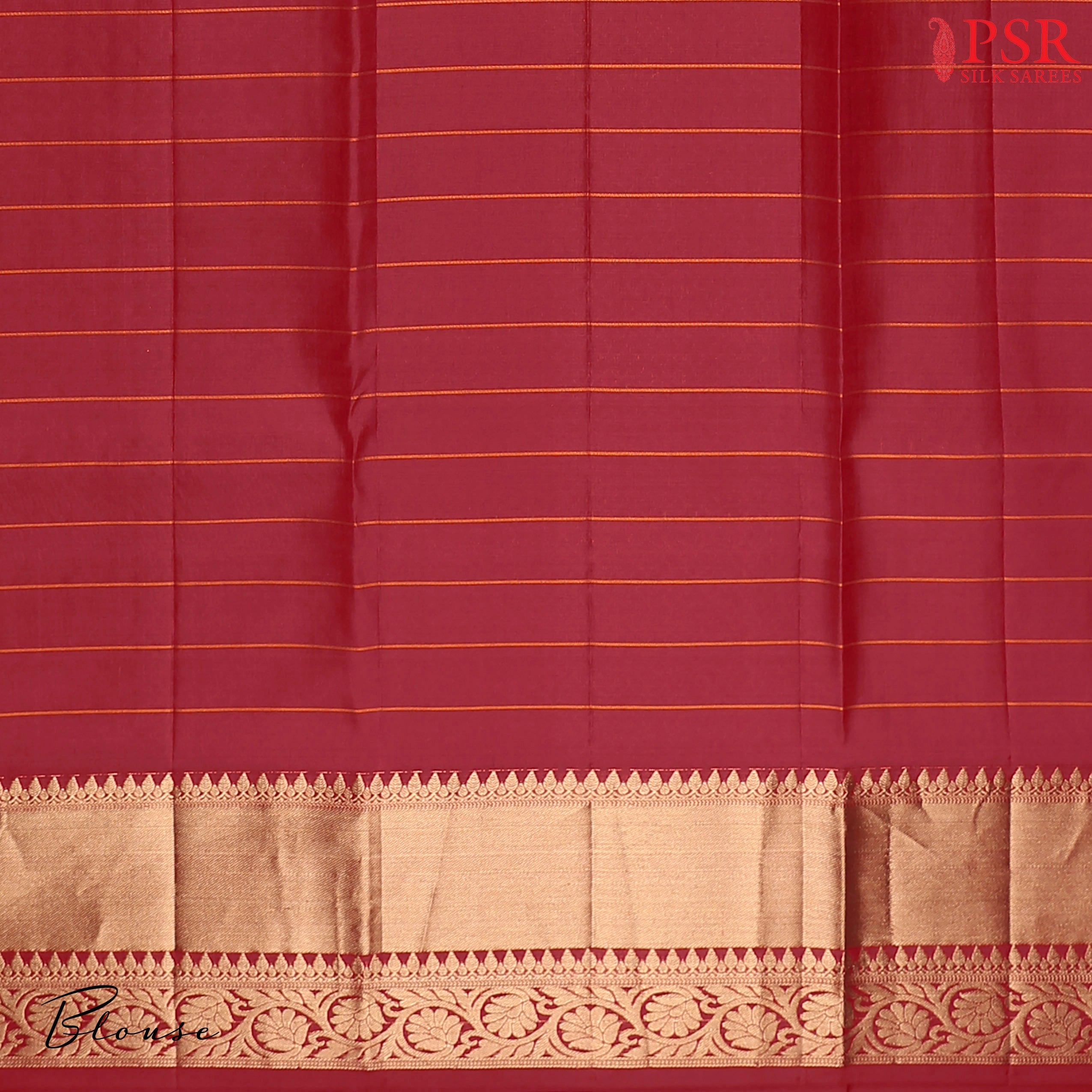 PSR Silks presents a Carmine Red Fancy Kanchipuram Silk Saree, elegantly paired with a zari checks pattern. A timeless blend of tradition and grace