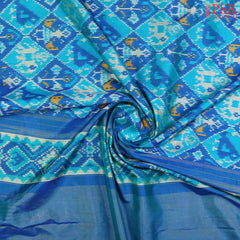 "Unveil the charm of tradition with PSR Silks’ Cerulean Blue Ikkat Pochampally Pure Silk Saree!