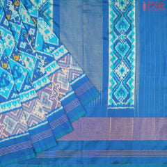 "Unveil the charm of tradition with PSR Silks’ Cerulean Blue Ikkat Pochampally Pure Silk Saree!