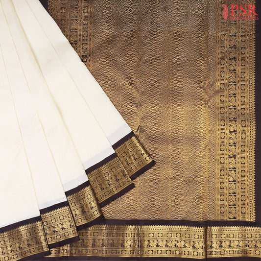 This Cream White &amp; Black Kanchipuram Silk Saree from PSR Silk Sarees is a timeless masterpiece from the Smartika Kanjivaram collection.