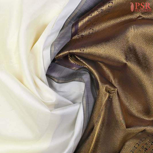 This Cream White & Black Kanchipuram Silk Saree from PSR Silk Sarees is a timeless masterpiece from the Smartika Kanjivaram collection.