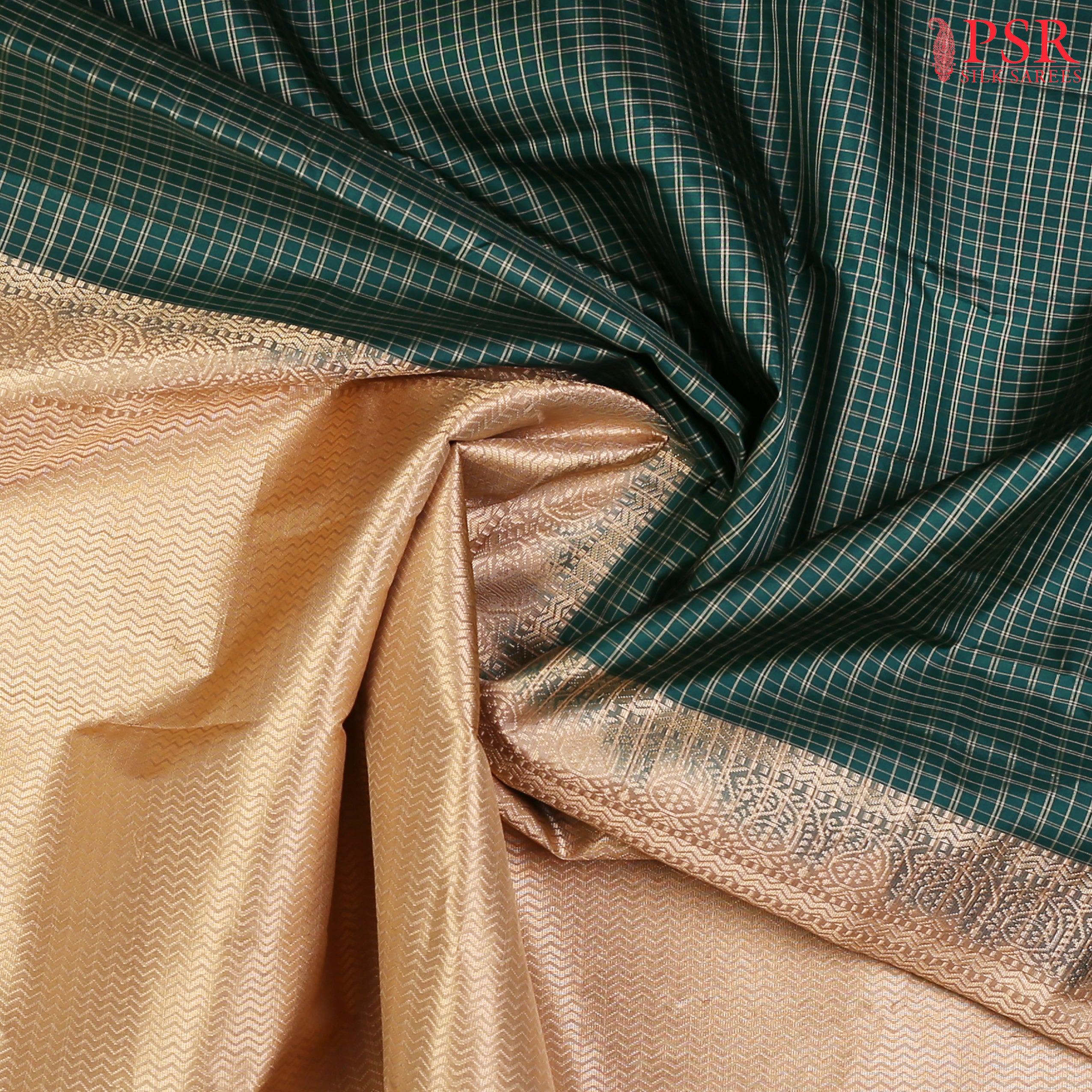 PSR Silks presents a Dark Green colored Arani Silk saree with combination of Tussar Beige color.