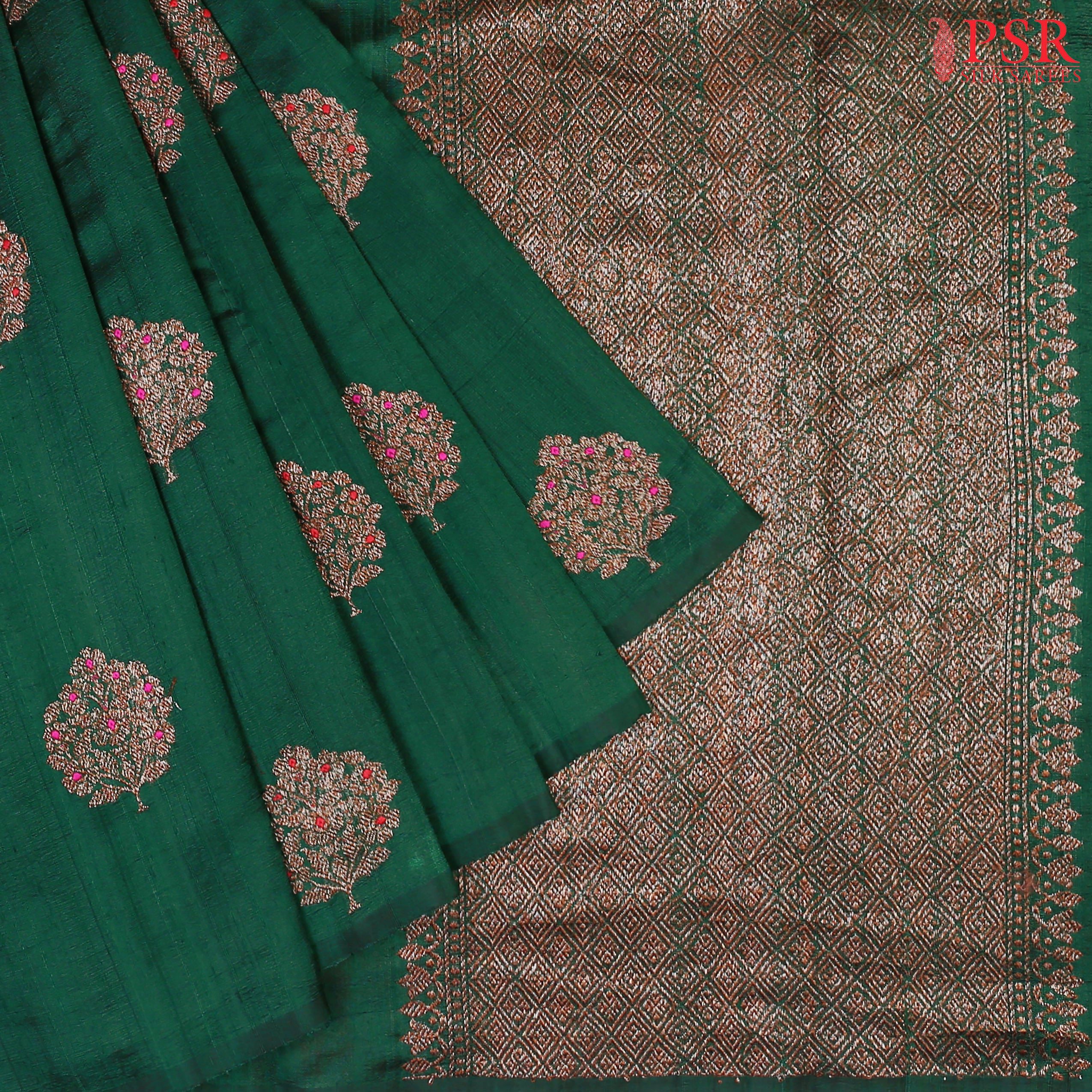 PSR Silks proudly presents a regal Dark Green&nbsp;Banaras Jute Silk Saree, paired with a rich Red&nbsp;combination.