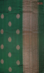 PSR Silks proudly presents a regal Dark Green&nbsp;Banaras Jute Silk Saree, paired with a rich Red&nbsp;combination.