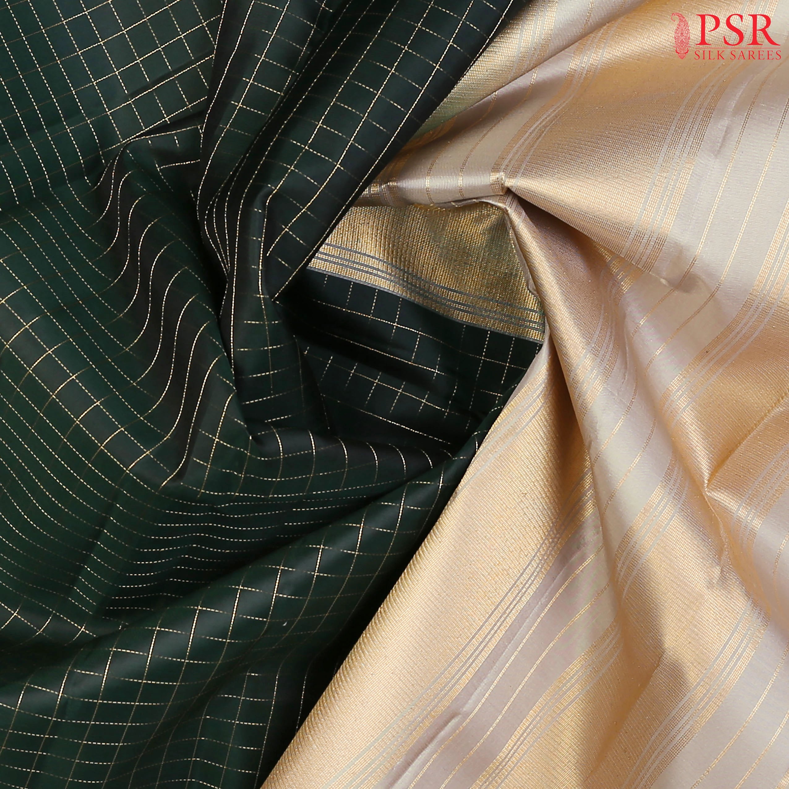 PSR Silks presents a Dark Green Fancy Kanchipuram Silk Saree, elegantly paired with a striking Gainsboro Grey combination. A timeless blend of tradition and grace!