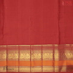 This Dark Green & Red Kanchipuram Silk Saree from PSR Silk Sarees is a timeless treasure from the Shrestha Kanjivaram