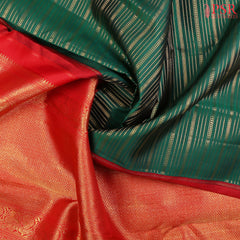 This Dark Green & Red Kanchipuram Silk Saree from PSR Silk Sarees is a timeless treasure from the Shrestha Kanjivaram