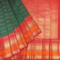 This Dark Green &amp; Red Kanchipuram Silk Saree from PSR Silk Sarees is a timeless treasure from the Shrestha Kanjivaram