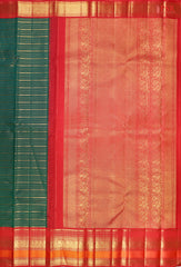 This Dark Green & Red Kanchipuram Silk Saree from PSR Silk Sarees is a timeless treasure from the Shrestha Kanjivaram