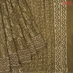 Dark Olive Pure Linen Saree featuring Jaipur-style paisley prints, a printed pallu, border, and a matching printed blouse.