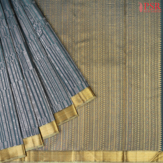 This Dark Teal &amp; Olive Grey Kanchipuram Silk Saree from PSR Silk Sarees is a timeless masterpiece from the "Vaichitrya Kanjivaram" collection.