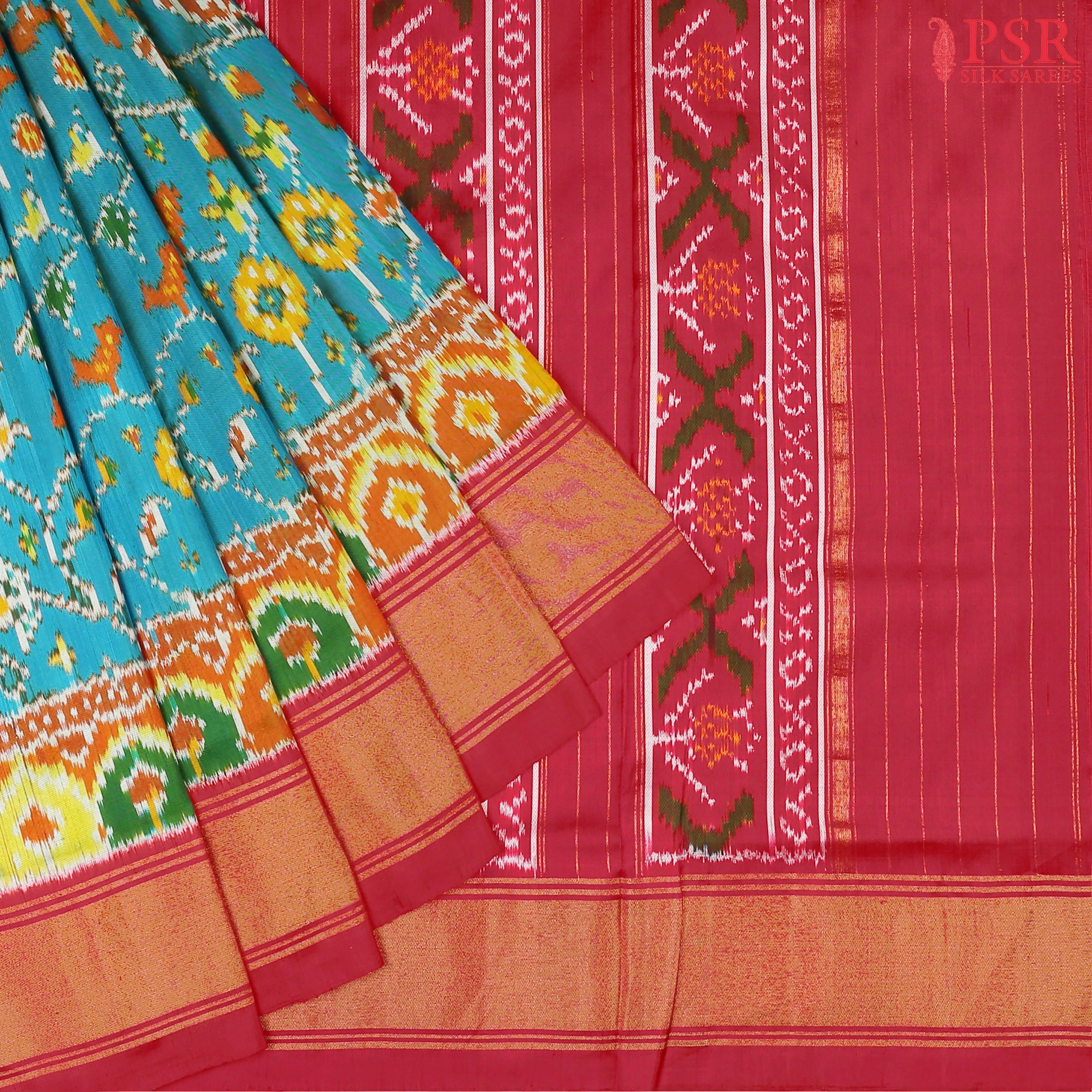 This Dark Turquoise &amp; Red Pochampally Silk Saree from PSR Silk Sarees is a stunning embodiment of heritage and vibrance