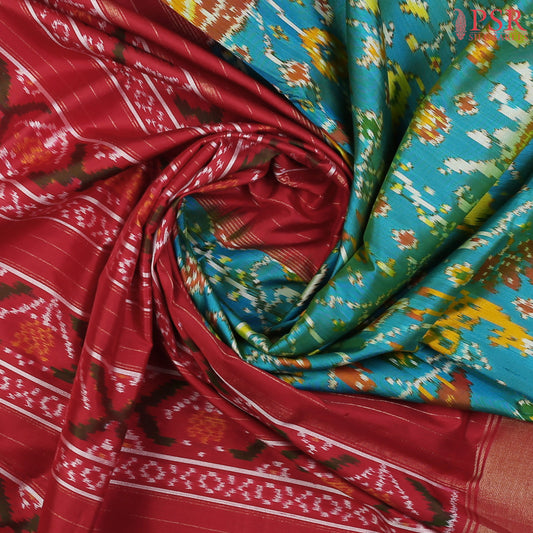 This Dark Turquoise &amp; Red Pochampally Silk Saree from PSR Silk Sarees is a stunning embodiment of heritage and vibrance