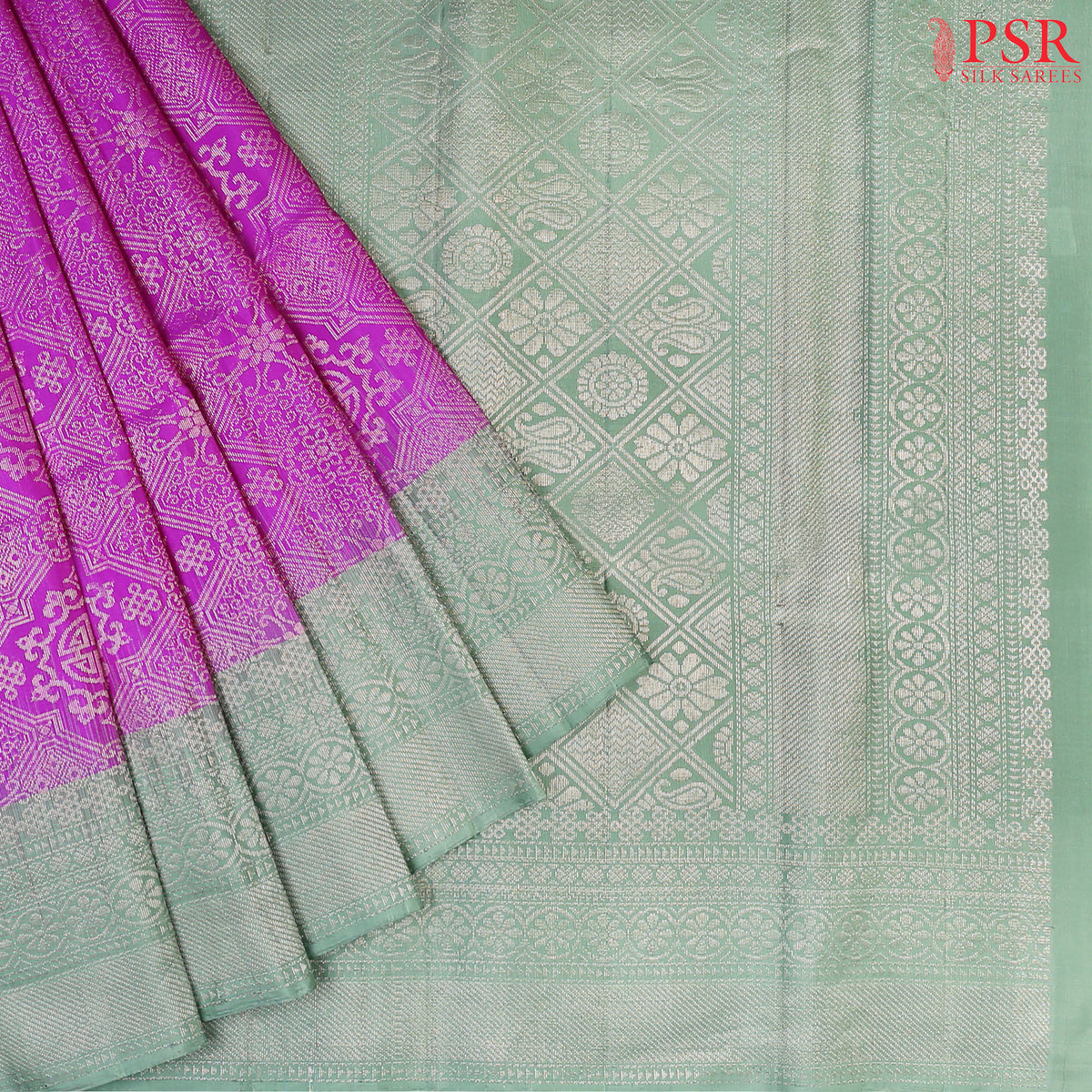 Embrace elegance with our Fandango Purple Soft Silk Saree, exquisitely paired with a Summer Green contrast. 