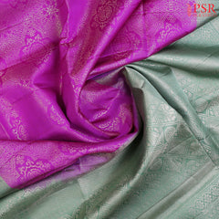 Embrace elegance with our Fandango Purple Soft Silk Saree, exquisitely paired with a Summer Green contrast. 