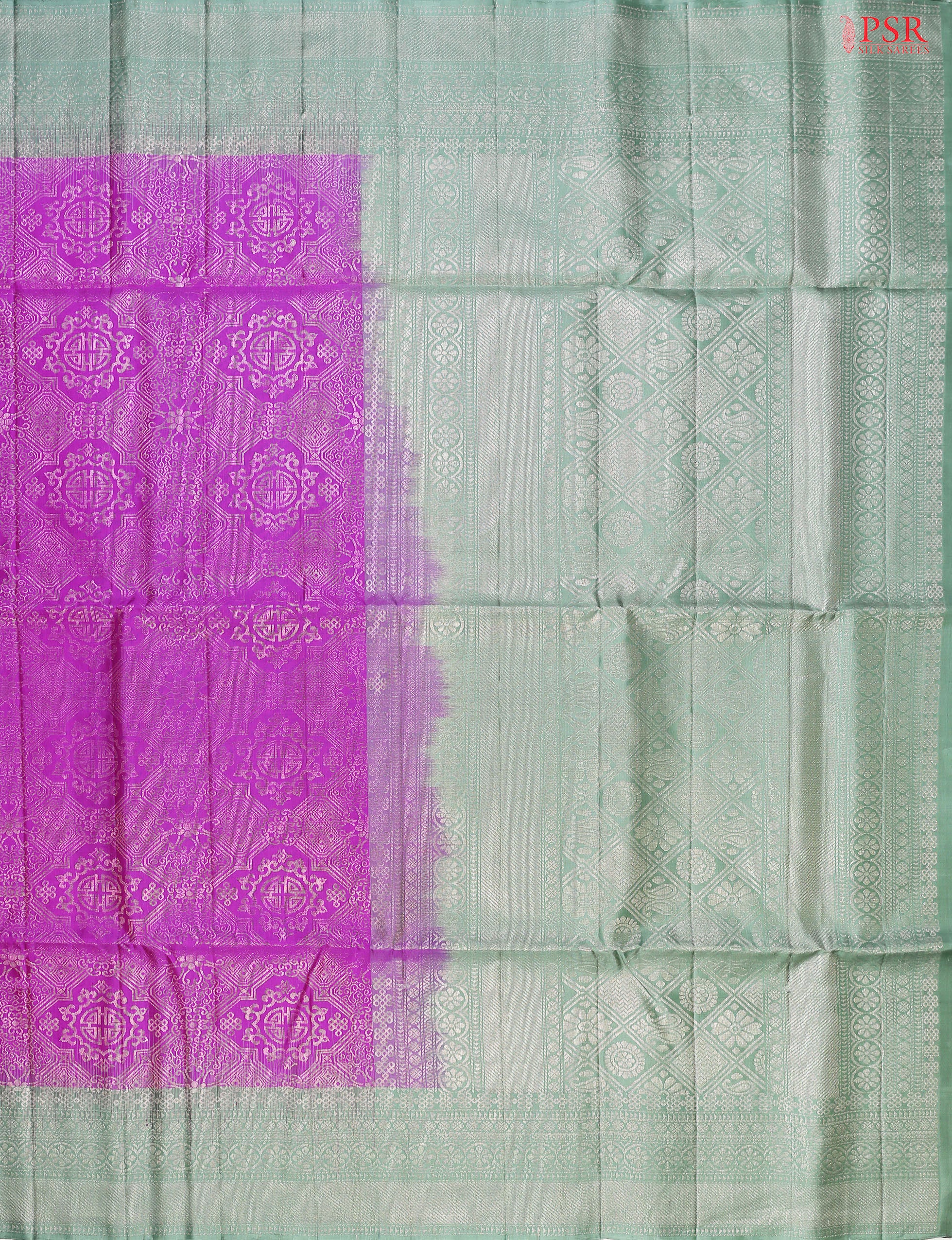 Embrace elegance with our Fandango Purple Soft Silk Saree, exquisitely paired with a Summer Green contrast. 