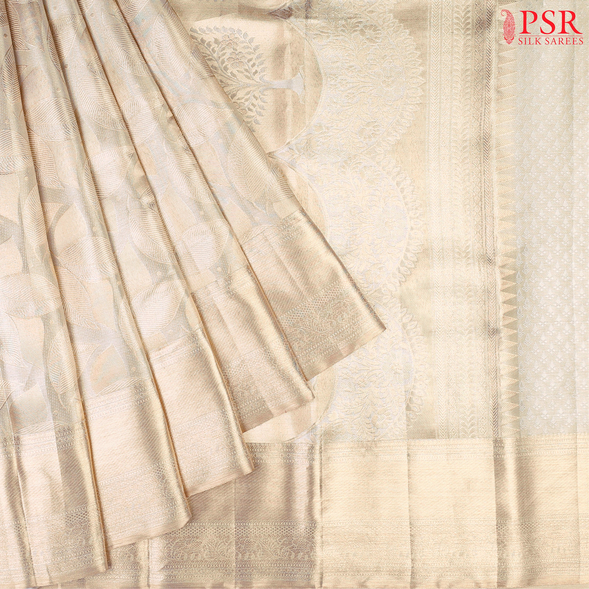 Beige Kanchipuram Silk Saree with a golden leaves jacquard pattern, rich zari pallu & border, and a designer zari work blouse—perfect for festive elegance.