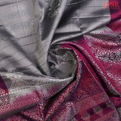 Drape yourself in sophistication with our Grey Soft Silk Saree, beautifully paired with a Tyrian Purple combination. 