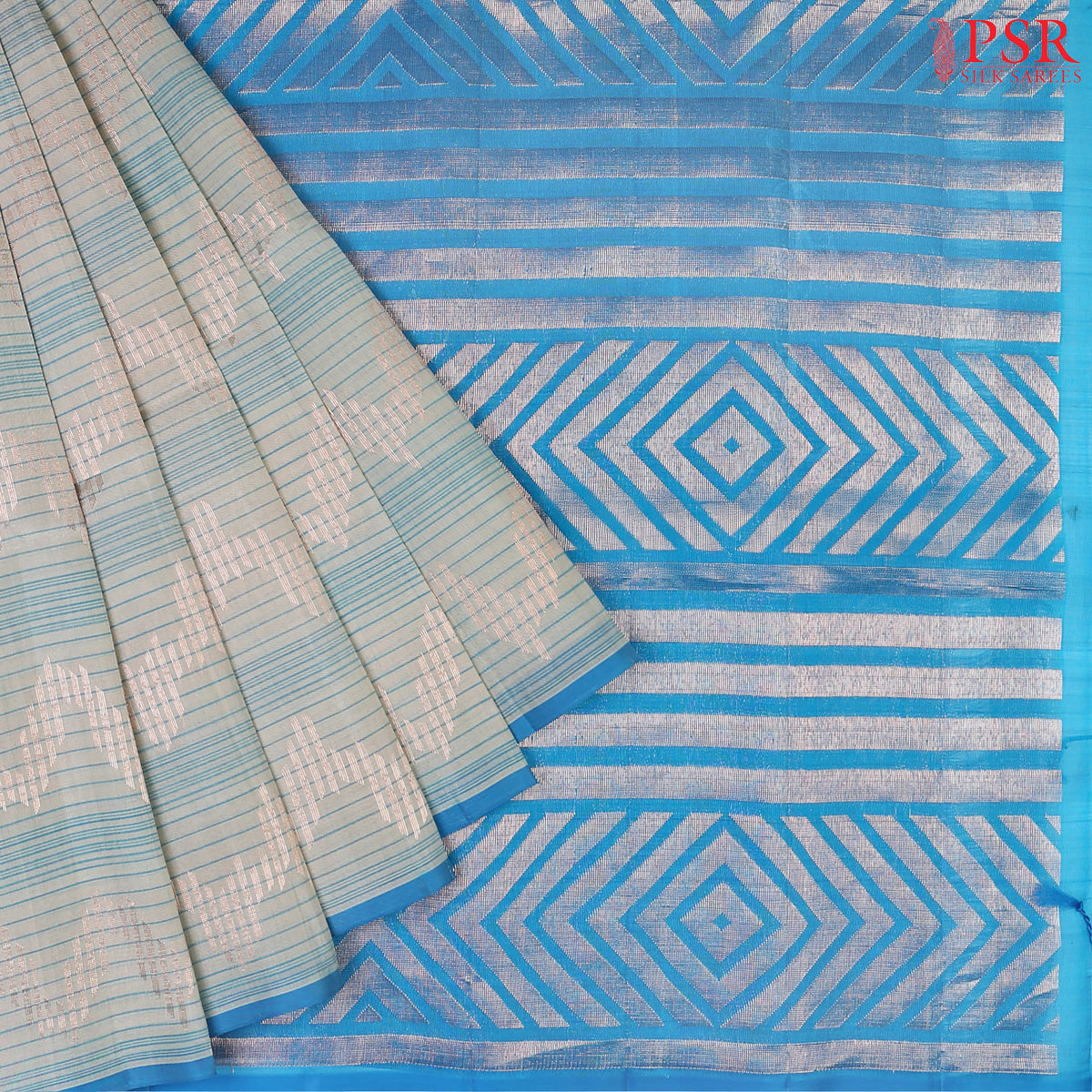 Indulge in the timeless beauty of our Haze Blue Kora Soft Silk Saree, gracefully paired with a Chintamani Blue contrast. 