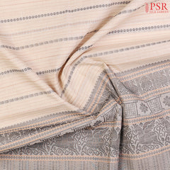 PSR Silks presents a traditional handloom Kalakshetra Kovai Cotton saree in a captivating Light Biege& beautifully weaved with Orange & black thread work.