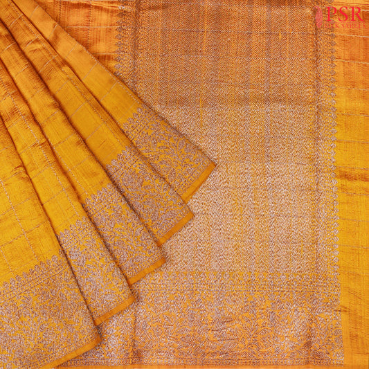 PSR Silks presents a stunning Marigold Banaras Jute Silk Saree, elegantly paired with a rich Jam Pink combination. 