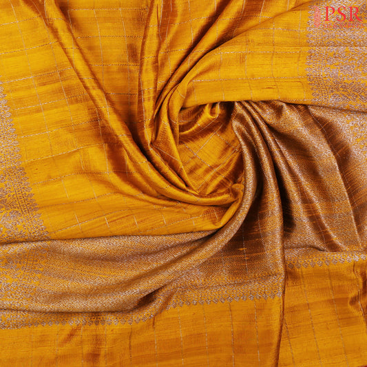 PSR Silks presents a stunning Marigold Banaras Jute Silk Saree, elegantly paired with a rich Jam Pink combination. 